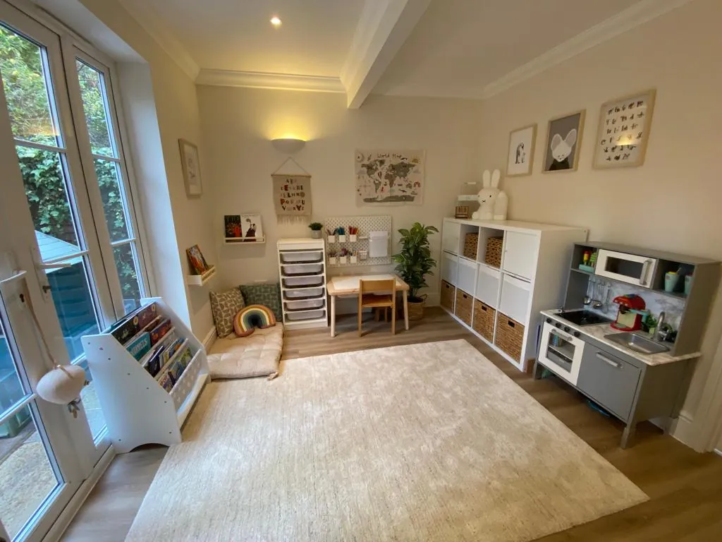 After organising: clear playroom floor and toys stored in baskets