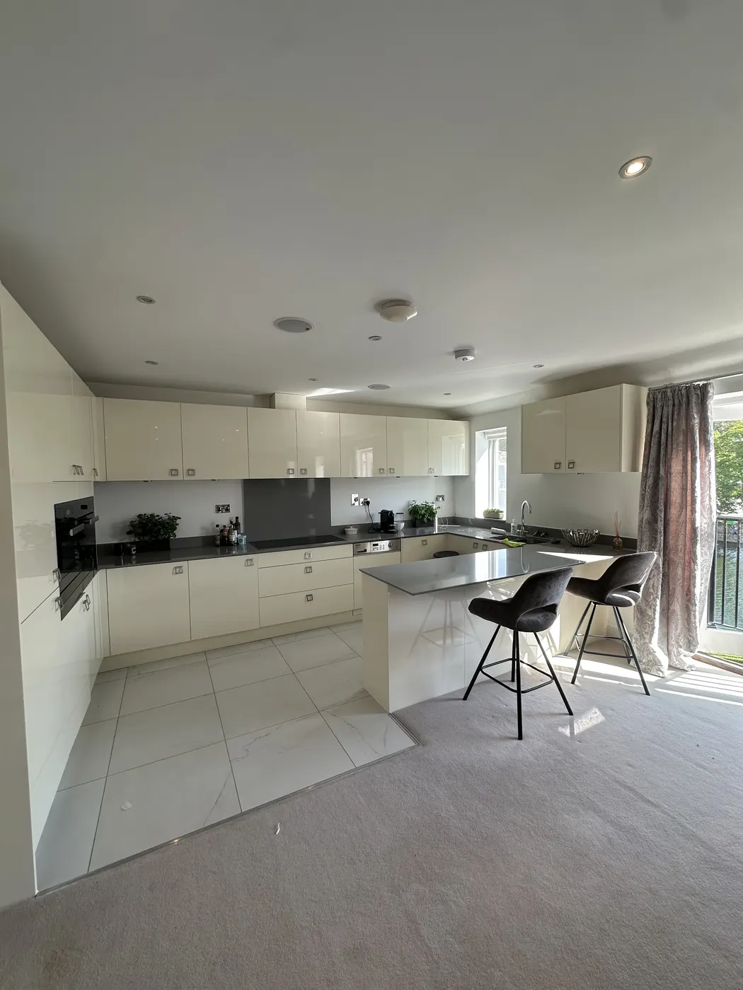 The same kitchen after unpacking, island and worktops clear
