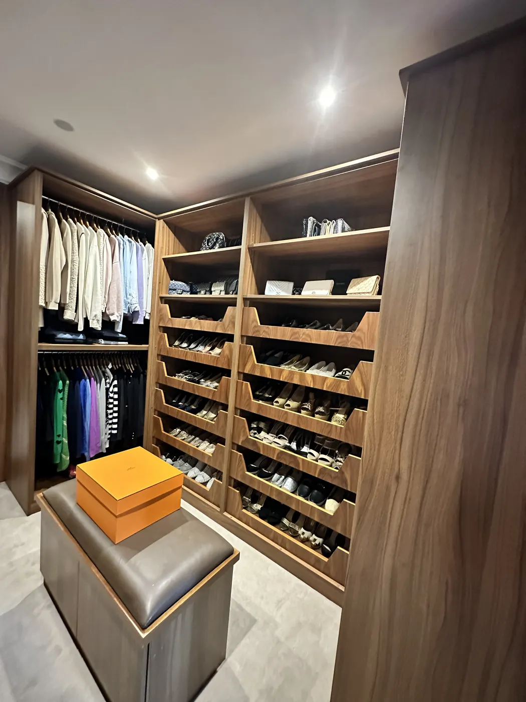 Walk-in dressing room after organising, viewed from the doorway